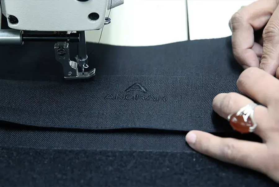 A stitchline being prepared on a bulletproof vest